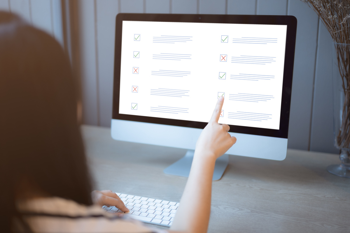 Woman passing online exam, Questionnaire online with checkboxes, Evaluation, Online survey online exam Choosing the right answer in the exam, Test questions. Filling out online survey form business.